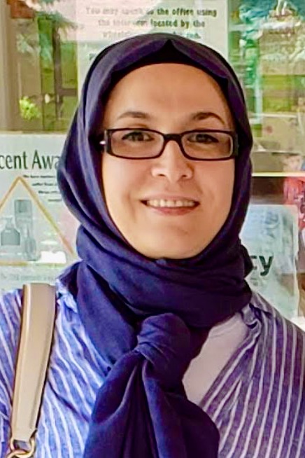 Melahat Yildirim, a friendly and helpful midwife wearing blue and white at Family Care Midwives